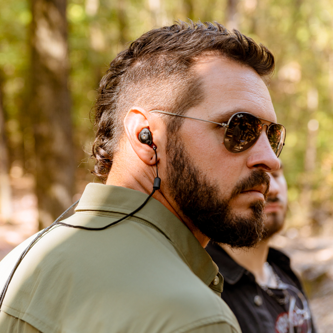 man wearing earplugs may cause earwax